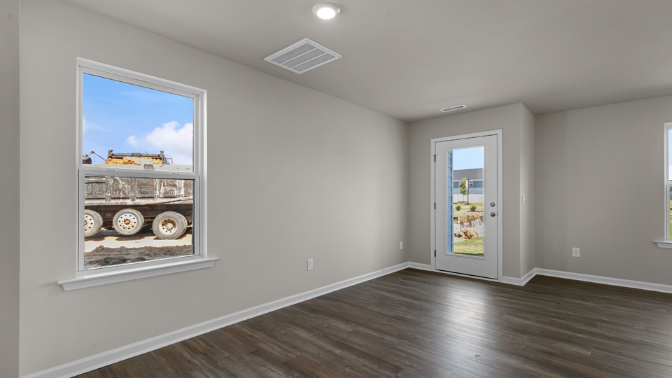 open concept living space with large windows