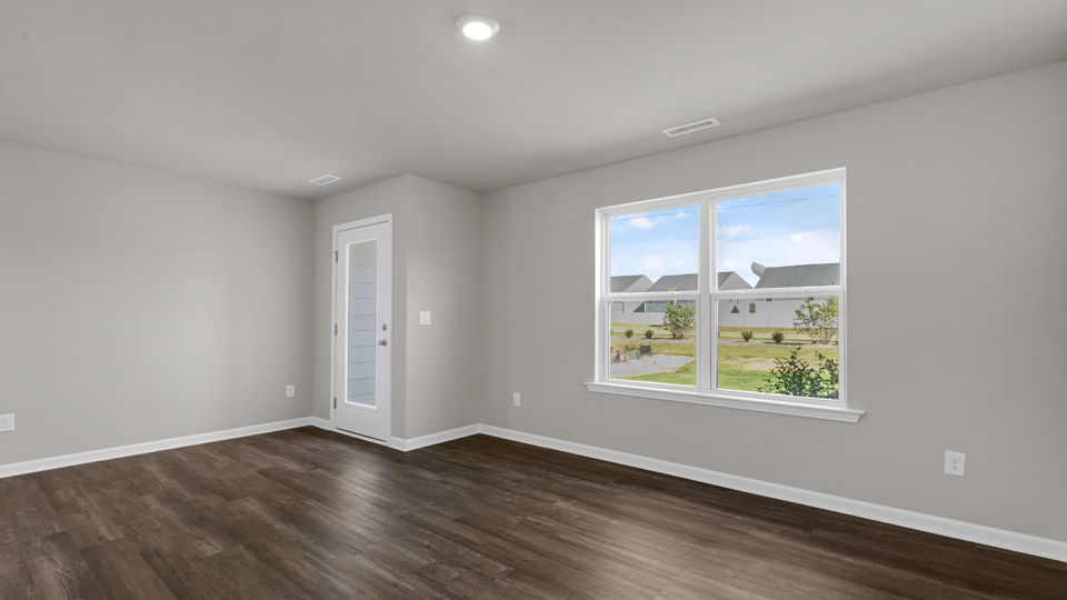 open concept living space with large windows