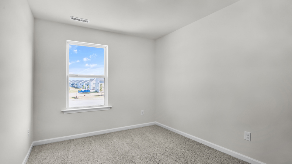 additional bedroom with window, carpeting, closet
