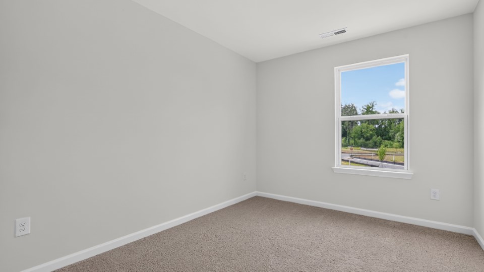 additional bedroom with window, carpeting, closet