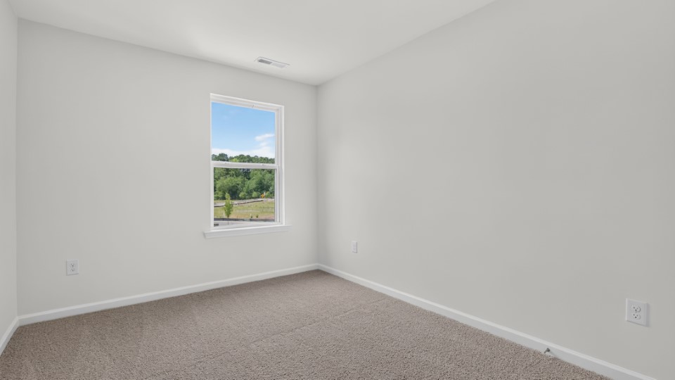 additional bedroom with window, carpeting, closet