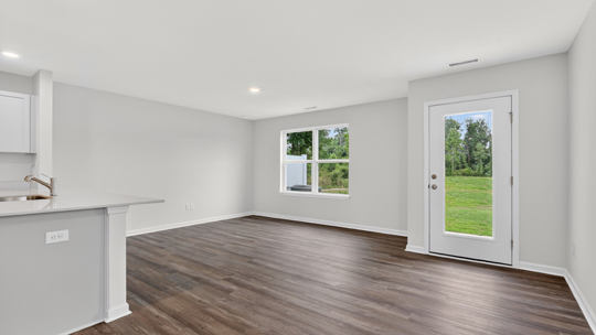 open concept living space with large windows