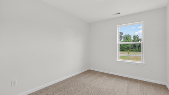 additional bedroom with window, carpeting, closet