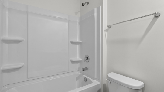 secondary bathroom with shower tub combo and single vanity sink