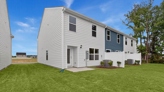 exterior patio with concrete slab and open yard