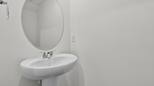 half bath with single pedestal sink