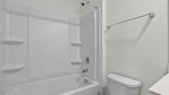 secondary bathroom with shower tub combo and single vanity sink