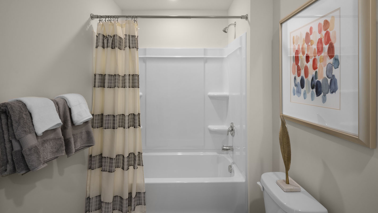 secondary bathroom with shower tub combo and single vanity sink