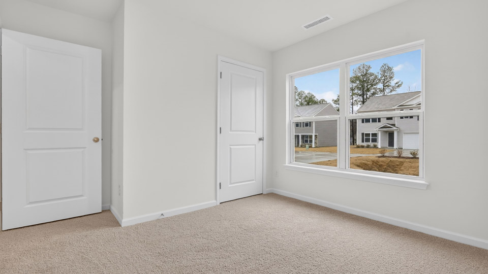 Bedroom with carpet floor and closet