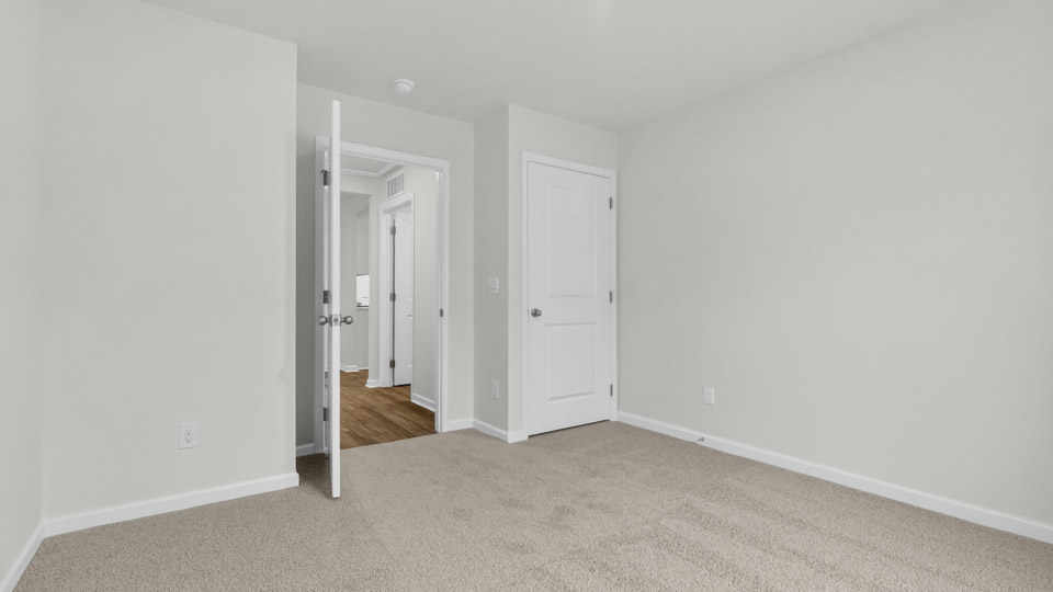 Bedroom with carpet floor and closet