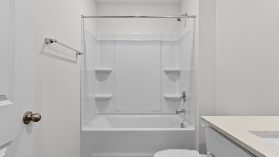 secondary bathroom with shower tub combo and single vanity sink