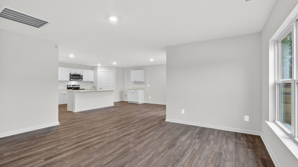 open concept living space with large windows