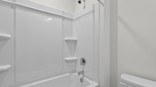 bathroom with tub shower combo
