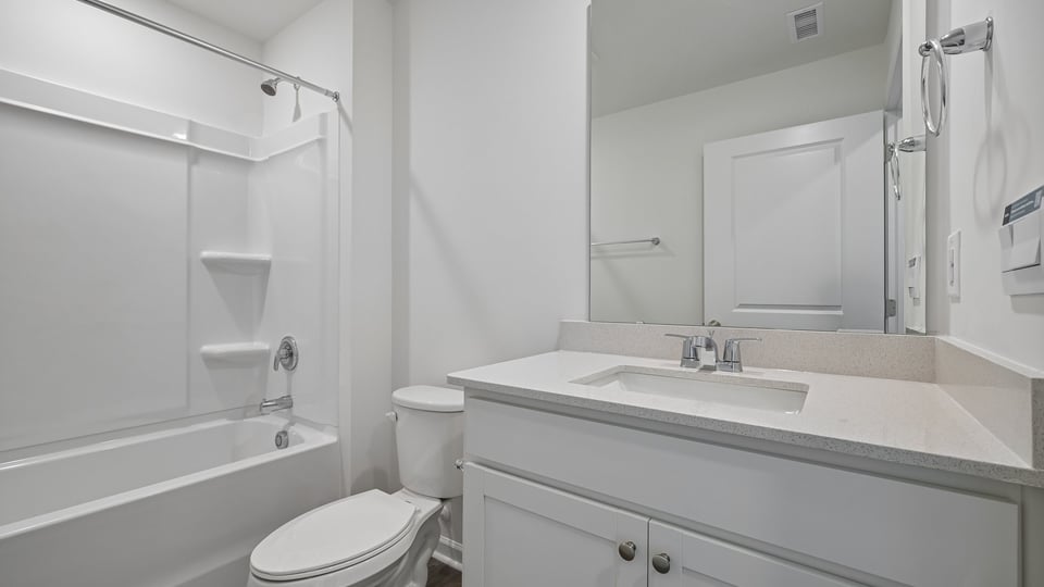 bathroom with tub shower combo
