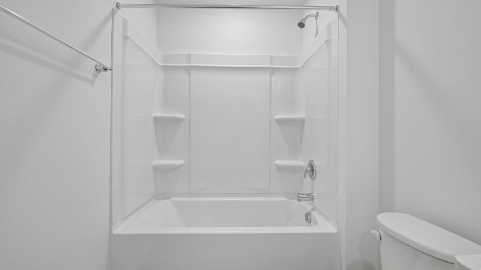 bathroom with tub shower combo