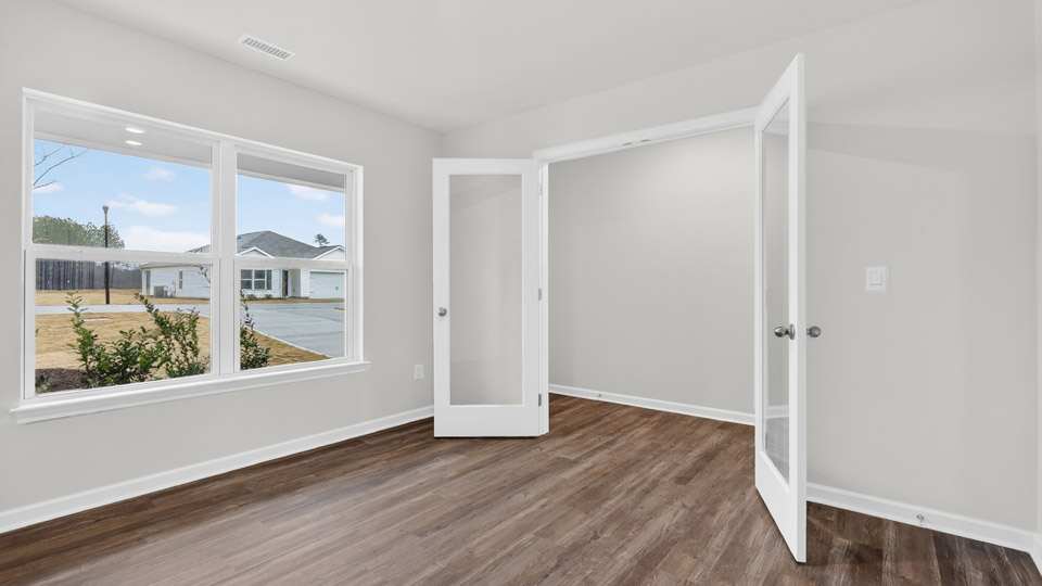 Study room with hardwood floors and big windows