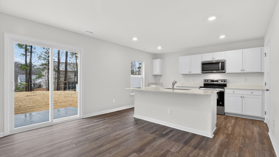 Kitchen with white cabinets and stainless steel appliances