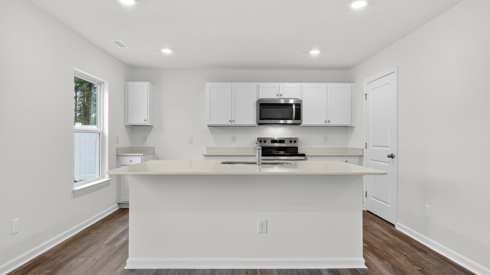 Kitchen with white cabinets and stainless steel appliances
