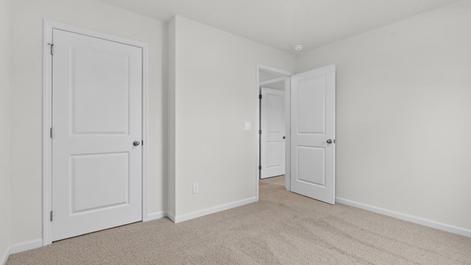 Bedroom with carpet floor and closet
