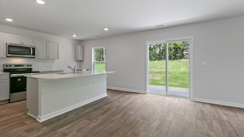 open concept dining space with sliding glass door to patio