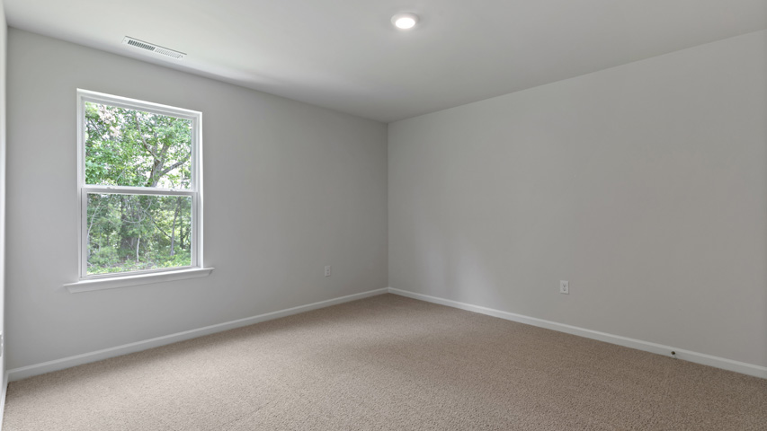 additional bedroom with window, carpeting, closet