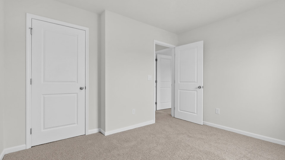 Bedroom with carpet floor and closet