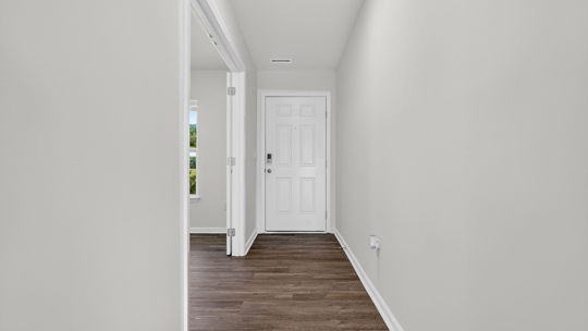 foyer entryway with revwood flooring