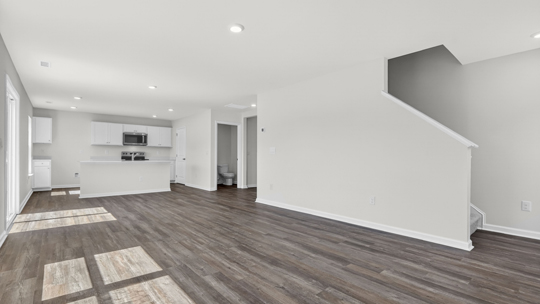 kitchen overlooking dining area and living room