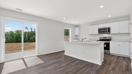kitchen with island and sliding glass doors to patio