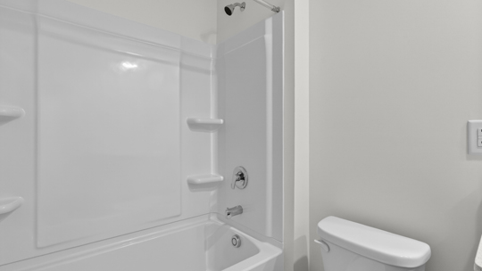 bathroom with tub shower combo