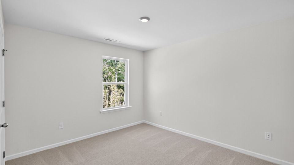 additional bedroom with window, carpeting, closet