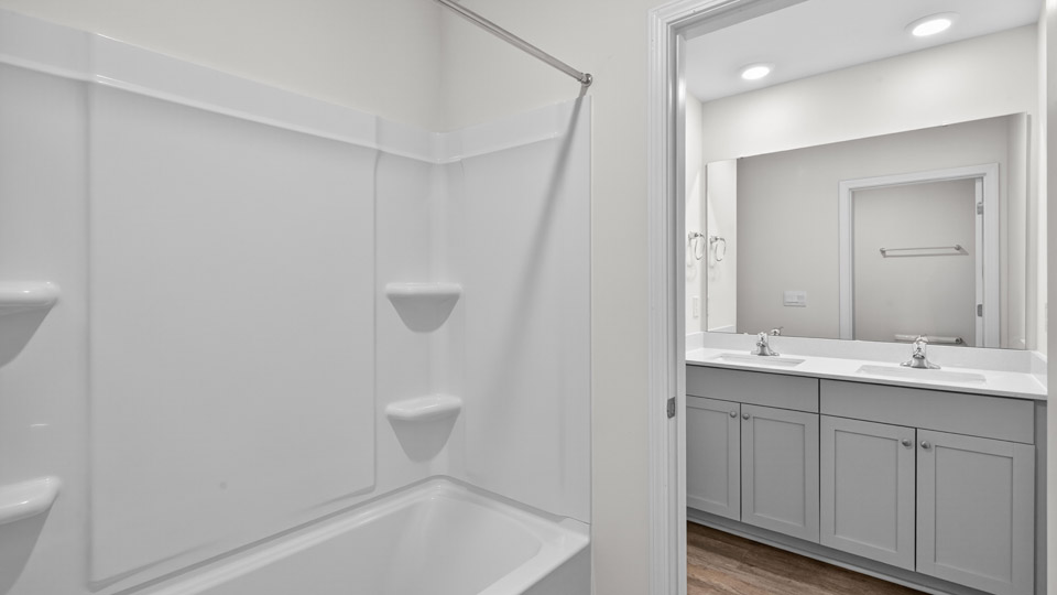 additional bathroom with double vanity sink