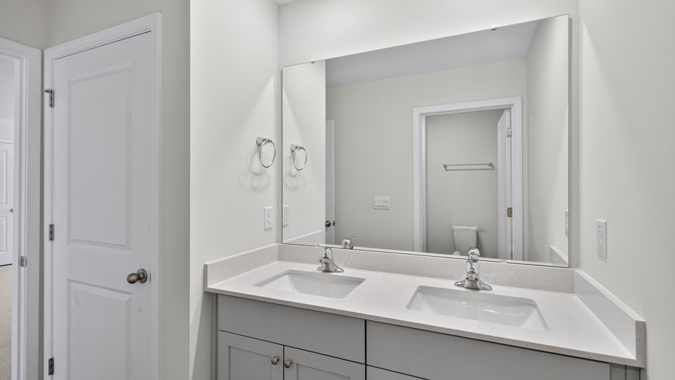additional bathroom with double vanity sink