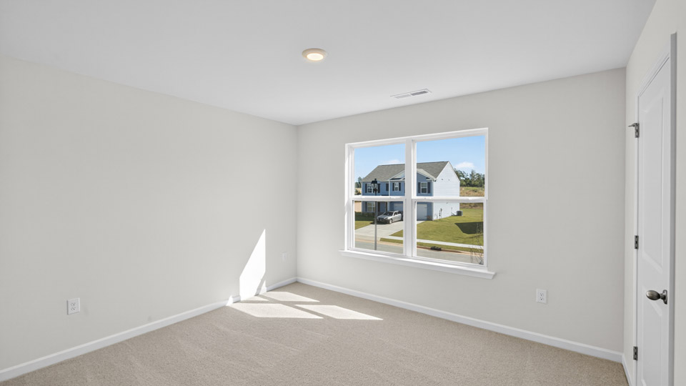 additional bedroom with window, carpeting, closet