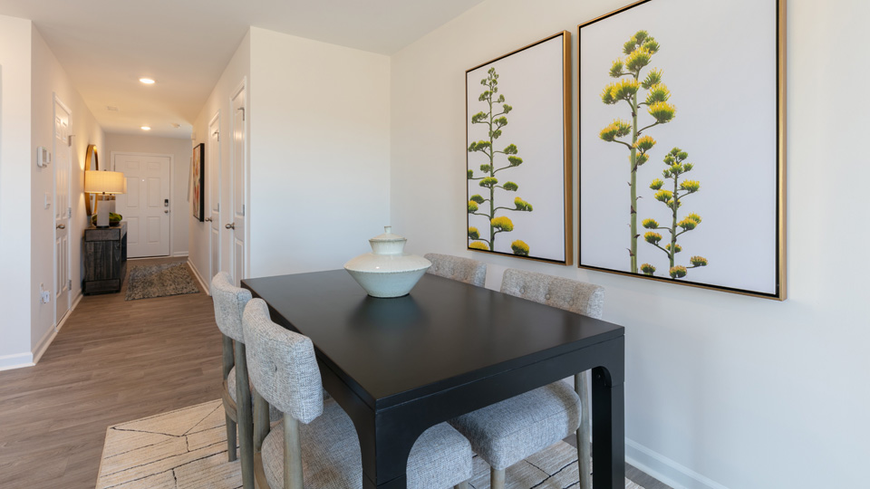 open concept dining space with glass door to patio
