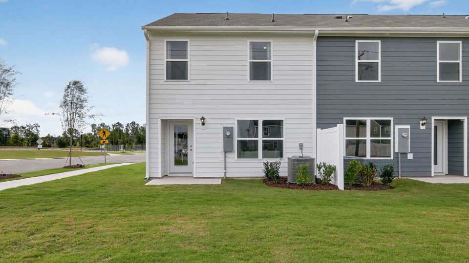 exterior patio with concrete slab and open yard