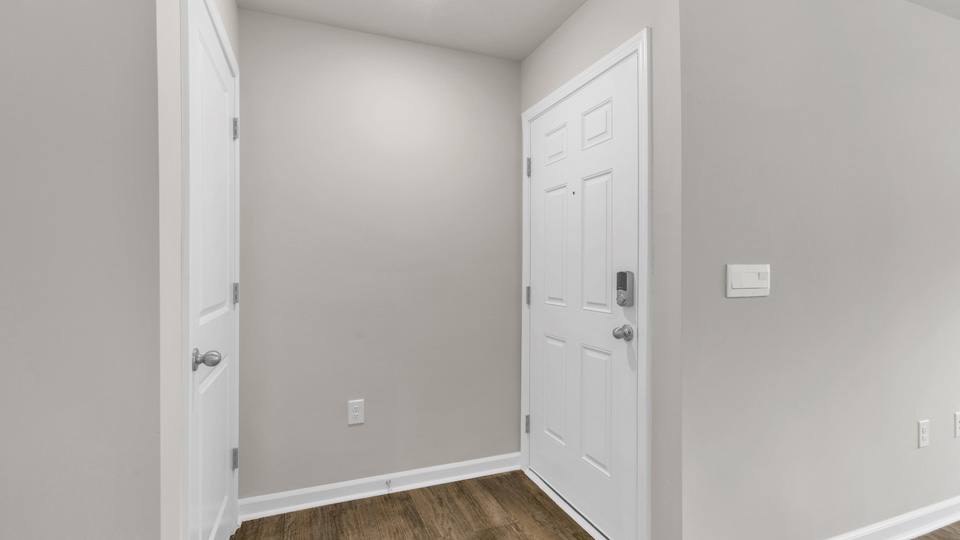 living area with revwood flooring