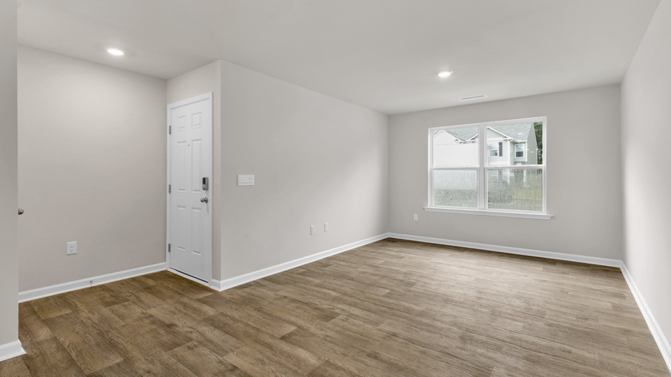 living area with revwood flooring