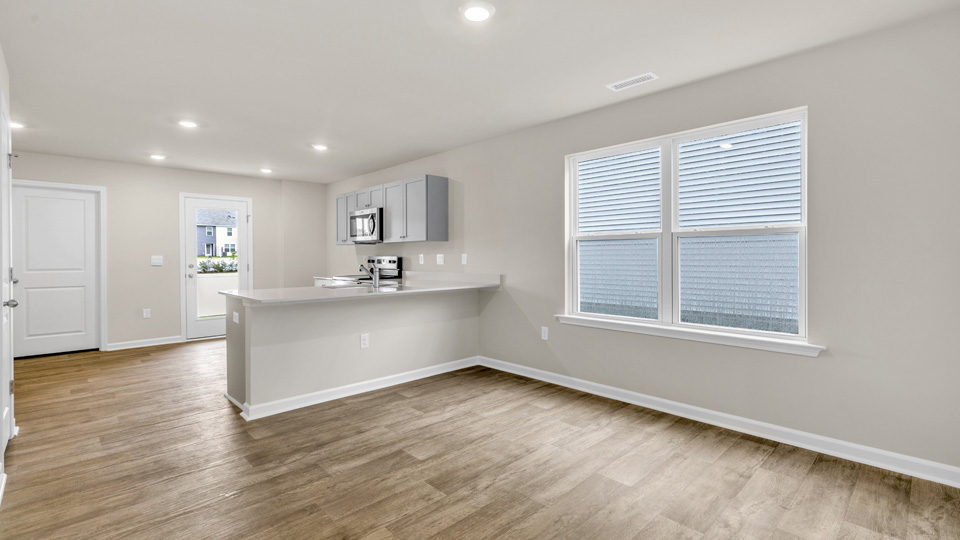 living area with revwood flooring