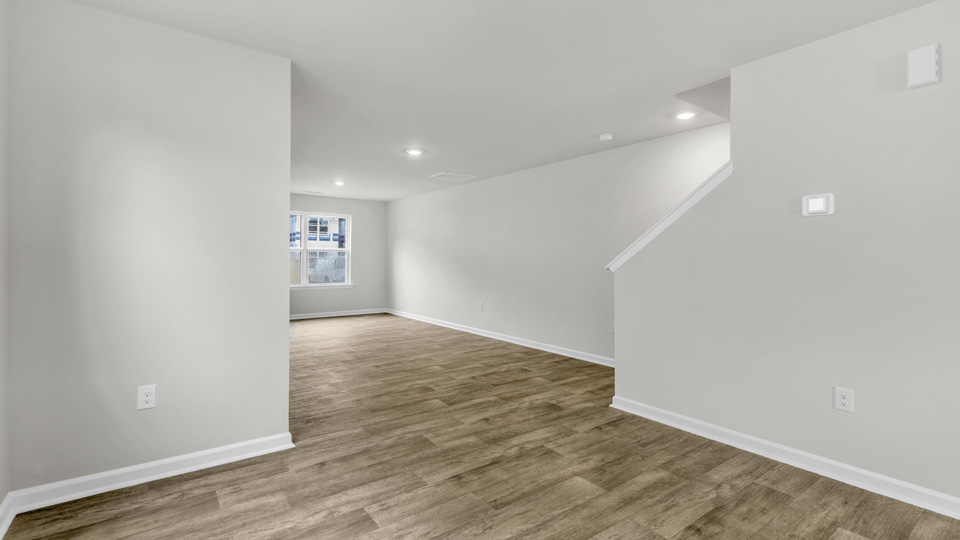 living area with revwood flooring
