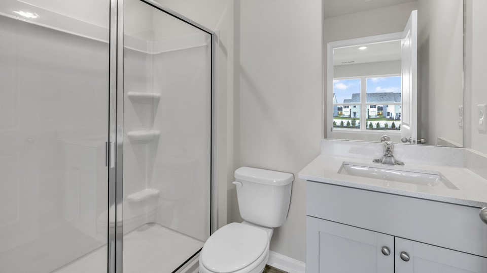 bathroom with white cabinets