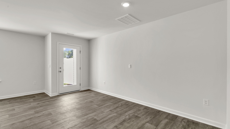 open concept dining space with door to patio