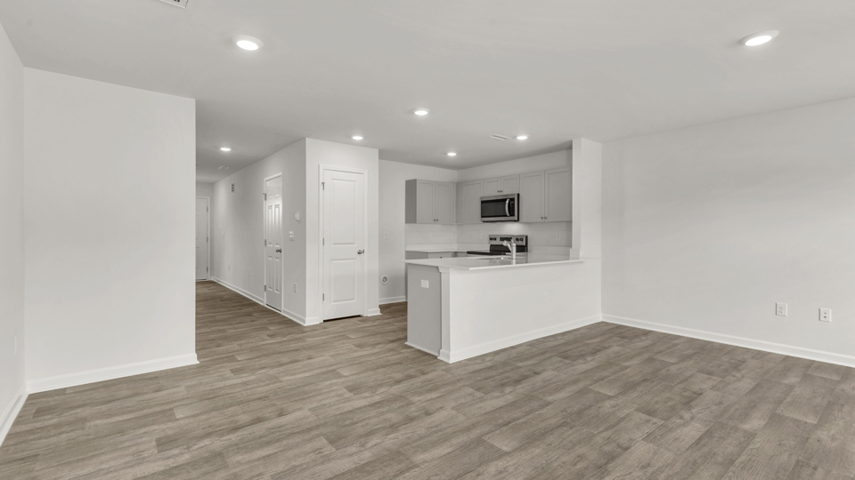 open concept living space with large windows