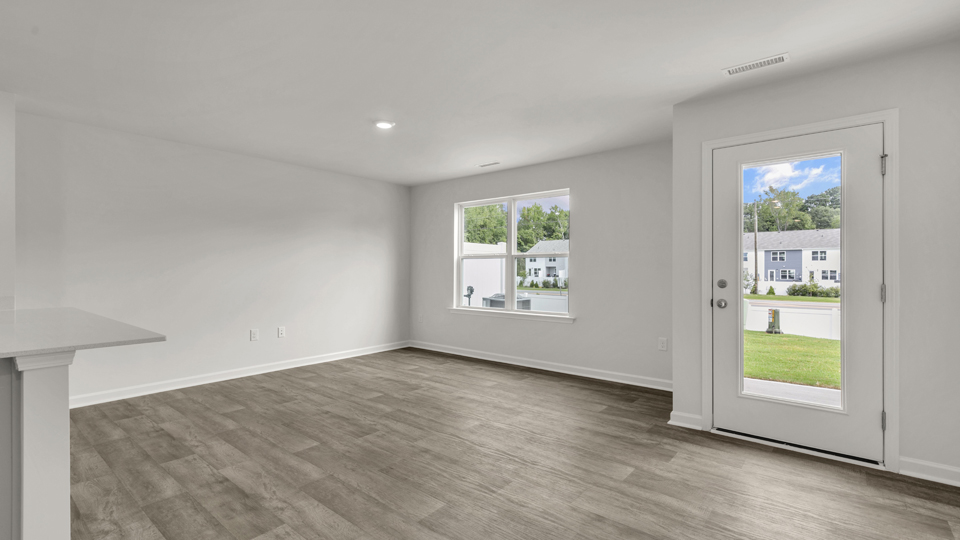 open concept dining space with door to patio