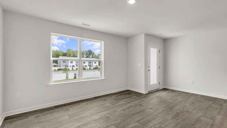 open concept living space with large windows