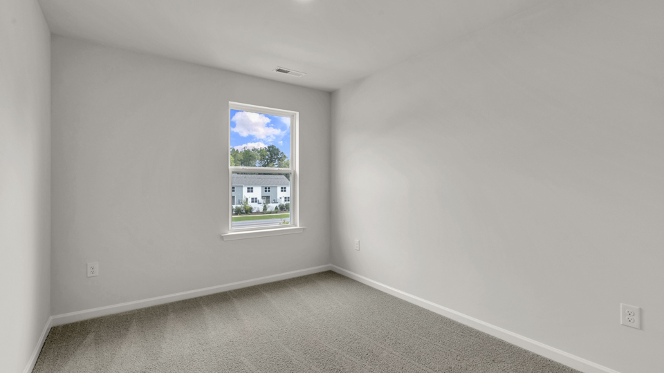 additional bedroom with window, carpeting, closet