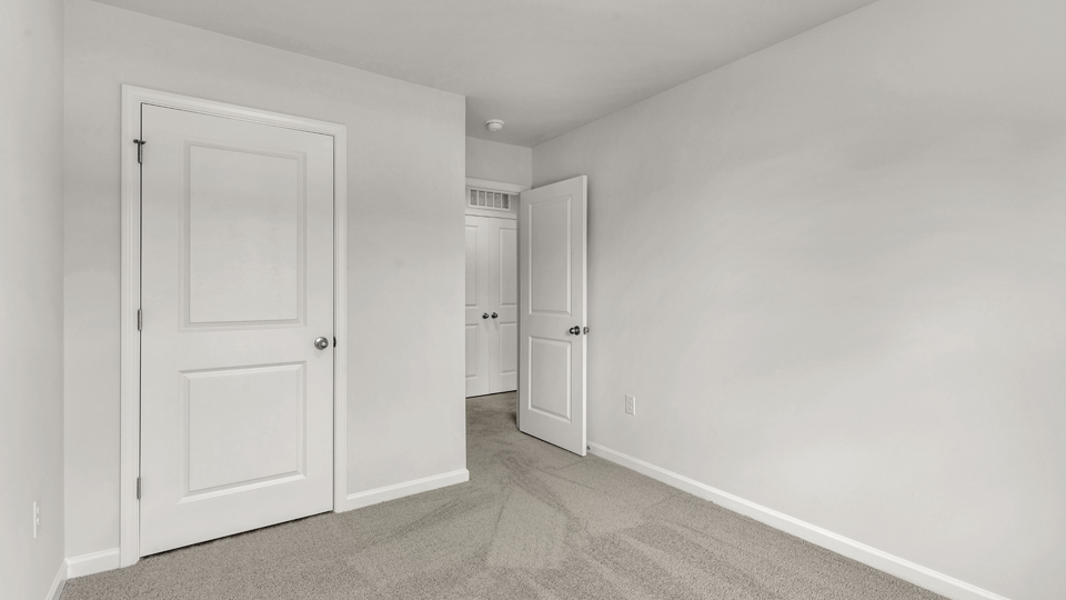 additional bedroom with window, carpeting, closet