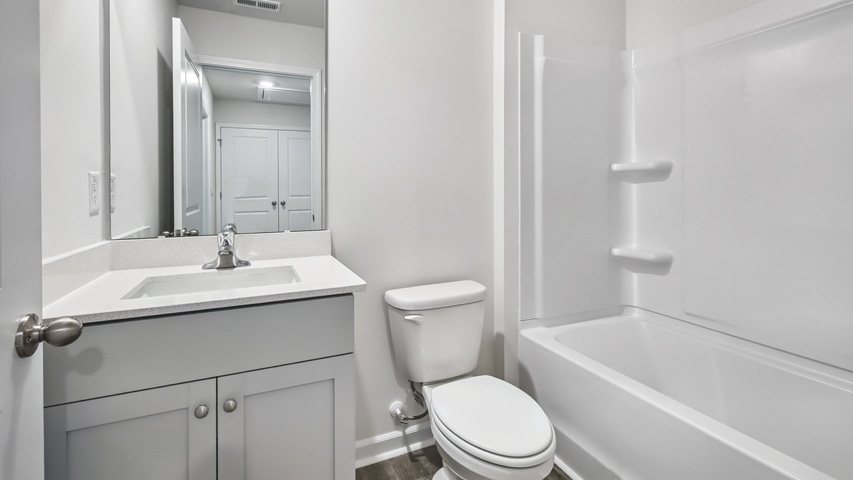 Bathroom with white cabinets