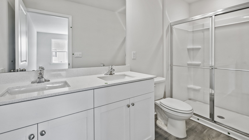 Bathroom with white cabinets
