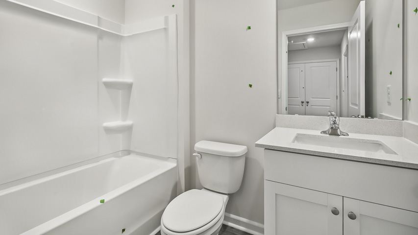Bathroom with white cabinets